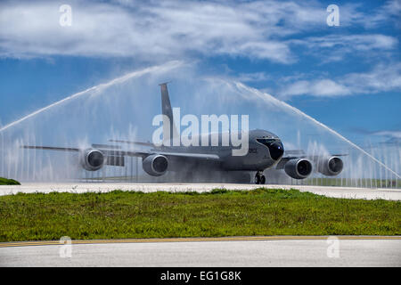 A KC-135 Stratotanker taxis through the wash rack, also known as a bird bath, after a mission at Andersen Air Force Base, Guam, Aug. 18, 2014. The KC-135 is assigned to the Air National Guard’s 134th Air Refueling Wing.  Tech. Sgt. Jonathan Young Stock Photo