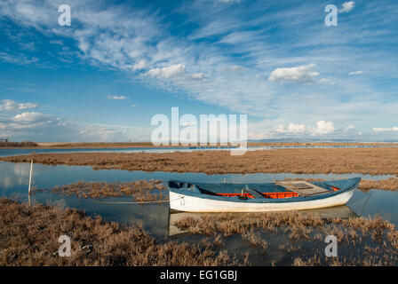 Landscape with traditional wooden boat in Axios Delta, near Thessaloniki, Greece. Stock Photo