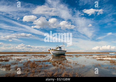 Landscape with traditional wooden boat in Axios Delta, near Thessaloniki, Greece. Stock Photo