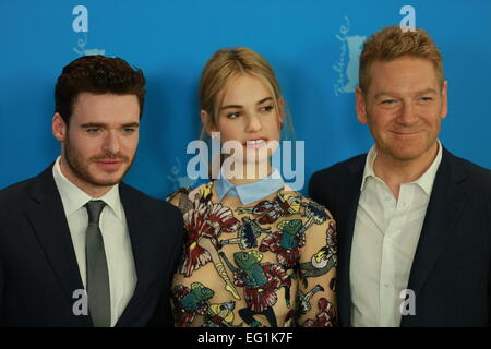 Actress Lily James (center), actor Richard Madden (left) and Director Kenneth Branaghat (right) during the photo call at the Hyatt Hotel on Potsdamer Platz. © Simone Kuhlmey/Pacific Press/Alamy Live News Stock Photo