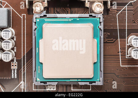 Central Processing Unit (CPU) Chip Installed On Motherboard Socket Stock Photo