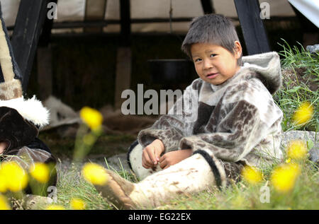 Greenland, Nanortalik, young boy in traditional full fur inuit costume. Stock Photo