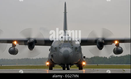 A C-130 Hercules taxis on the flightline July 14, 2014, at Westover Air Reserve Base, Mass. The C-130 crew picked up 12 Airmen assigned to the 439th Aeromedical Evacuation Squadron. AE units provide tactical aeromedical evacuation for injured U.S. troops and regional unified commands. Flight nurses and medical technicians have the capability to fly patients on more than five different aircraft, which include the C-17 Globemaster III, KC-135 Stratotanker, C-21, C-130, and the KC-10 Extender.  Staff Sgt. Kelly Goonan Stock Photo