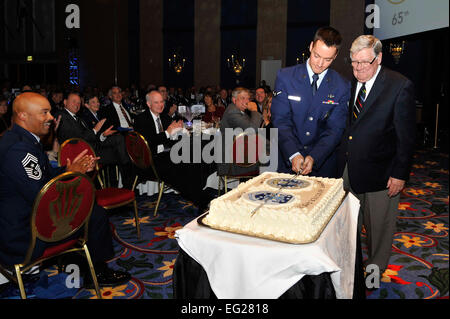 Retired Maj. Gen. Tim Padden and Airman Samuel Macklin, cut the ceremonial cake during a banquet hosted by the Space Foundation in honor of Air Force Space Command’s 30th anniversary celebration Sept. 14, 2012, in Colorado Springs, Colo.  Padden was the third commander of AFSPC and Macklin is from the 721st Security Forces Squadron at Cheyenne Mountain Air Force Station.  Staff Sgt. Christopher Boitz Stock Photo