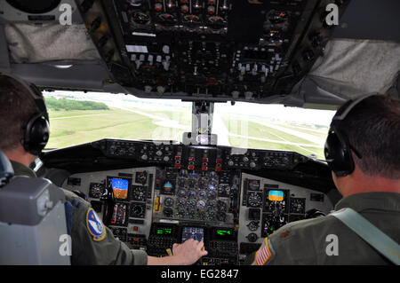 Captain C.J. Hein and Maj. Brian Colby, pilots assigned to the 18th Air Refueling Squadron, line up a KC-135 Stratotanker for landing at McConnell Air Force Base, Kan., following an air refueling training mission, May 12, 2014. The two pilots had successfully rendezvoused with a pair of B-52 Stratofortress aircraft from Barksdale Air Force Base, La., in the sky over west Texas to practice air refueling techniques and to maintain proficiency.  Capt. Zach Anderson Stock Photo