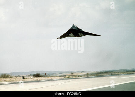 An F-117 stealth fighter aircraft takes off on its return flight to the United States following deployment to the region during Operation Desert Storm. Stock Photo