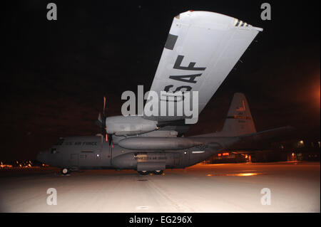 A C-130 Hercules from the 133rd Airlift Wing, Minnesota Air National Guard, sits on the tarmac at the Minneapolis St. Paul International Airport January 30, 2010.The C-130 Hercules primarily performs the tactical portion of the airlift mission. The aircraft is capable of operating from rough, dirt strips and is the prime transport for air dropping troops and equipment into hostile areas. United States Air Force photo by Tech Sgt Erik Gudmundson Released Stock Photo