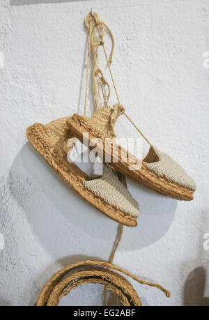 A pair of espadrilles, made of Esparto, halfah grass, or esparto grass in Ethnological Museum Mijas, Andalusia, Spain. Stock Photo