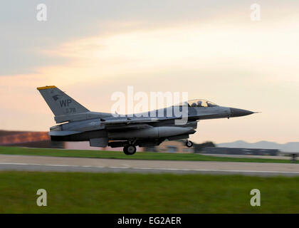 An F-16 Fighting Falcon assigned to the 80th Fighter Squadron takes off during Exercise Beverly Midnight 13-3 Aug. 6, 2013, at Kunsan Air Base, South Korea. This was one of the first flights of Beverly Midnight, 13-3 which tests the capabilities of ground and aircrew during a wartime scenario.  Staff Sgt. Jessica Haas Stock Photo