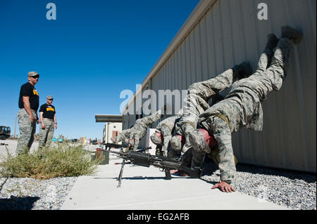 Students attending the Ranger Assessment Course receive motivational training from their instructors at the Nevada Test and Training Range, Oct. 3, 2014. The course offers Airmen the opportunity to develop and prove themselves in an intense training environment to see if they can meet the requirements to attend the U.S. Army Ranger School.  Airman 1st Class Thomas Spangler Stock Photo