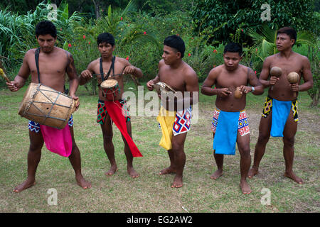 Indigenous Embera men in traditional dress with musical instruments ...