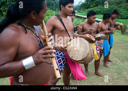 Indigenous Embera men in traditional dress with musical instruments ...