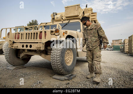 Senior Airman Leah Johnson checks the weight of a vehicle scheduled for shipping Sept. 22, 2013, at Forward Operating Base Salerno, Khost Province, Afghanistan. The 19th Movement Control Team is a small squadron of Air Force surface movement controllers and aerial porters who oversee the majority of retrograde operations at FOB Salerno. Johnson, a St. Paul, Minn. native, is deployed from Travis Air Force Base, Calif.  Master Sgt. Ben Bloker. Stock Photo