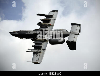 An A-10 Thunderbolt II does a show of force maneuver after locating a simulated downed pilot during RED FLAG-Alaska 13-3, Aug. 22, 2013, at Eielson Air Force Base, Alaska. Two A-10s defended the pilotÕs position until members of the 210th Rescue Squadron could rescue him. The A-10 is assigned to the 163rd Fighter Squadron, Indiana Air National Guard, Ft. Wayne, Ind. Senior Airman Shawn Nickel Stock Photo