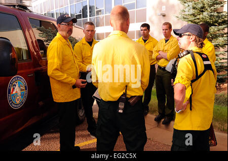 Firefighters with the U.S. Air Force Academy's 10th Civil Engineer Squadron receive a safety briefing in the Pine Valley housing area June 26, 2012. Mandatory evacuations have been ordered for all housing residents of the Academy as this fire continues to spread. Mike Kaplan Stock Photo