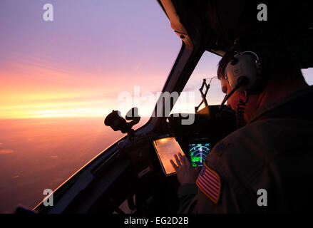 Lt. Col. Matthew Yaun conducts aerial operations during a training flight onboard a C-17 Globemaster III Sept. 8, 2014, near Joint Base Charleston, S.C. Training flights are vital to the operational success of Airmen because they help develop the necessary skills for combat and humanitarian missions. Yaun is a pilot assigned to the 300th Airlift Squadron.  Tech. Sgt. Barry Loo Stock Photo