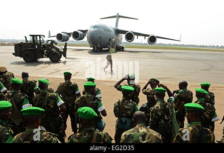 Rwandan soldiers form up after a C-17 Globemaster III based out of McChord Air Force Base, Wash. dropped them off in the Central African Republic Jan. 19, 2014. U.S. forces will transport a total number of 850 Rwandan soldiers and more than 1,000 tons of equipment into the Central African Republic to aid French and African Union operations against militants during this three week-long operation.  Staff Sgt. Ryan Crane Stock Photo
