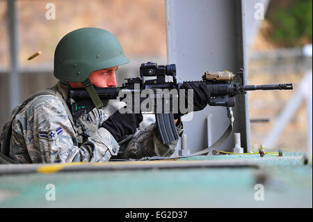 Airman 1st Class Charles Manarino zeroes in his weapon before a shooting exercise March 7, 2013, at the Jinjui Air Force Education and Training Command firing range, South Korea. The air police special-duty team course aims to train American and Korean airmen in tactics for base defense. Manarino is a 51st Security Forces Squadron member. Staff Sgt. Emerson Nuñez Stock Photo