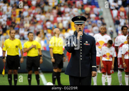 A U.S. Air Force member sings the National Anthem before a Major League Soccer match as part of Air Force Week 2012 at the Red Bulls Arena in Harrison, N.J., Aug. 19, 2012. During Air Force Week, events included flyovers, drill team performances, military working dog demonstrations and a water rescue demonstration.  Senior Airman Grovert Fuentes-Contreras Stock Photo