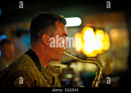 Master Sgt. Jake McCray, Air Forces Central Command Band “Vector” saxophonist, performs on the Boardwalk at Kandahar Airfield in Afghanistan on April 16.  Senior Airman Scott Saldukas Stock Photo