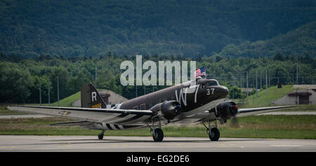 A Douglas C-47 Skytrain troop carrier aircraft, designated Whisky 7, lands on Ramstein Air Base, May 26, 2014. Whisky 7 was the lead carrier of 37th Troop Carrier Squadron that took part in dropping the 82nd Airborne Division near St. Mere Eglise, France during D-Day, June 6th, 1944. The historical aircraft landed in Ramstein before heading to Normandy to take part in commemoration events for the 70th Anniversary D-Day. Airman 1st Class Jordan Castelan Stock Photo