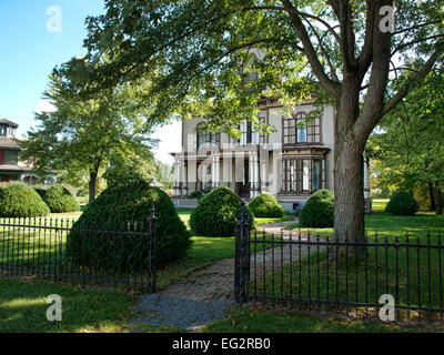 Victorian home with iron gates Stock Photo