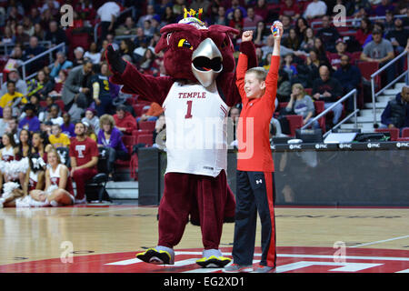 Philadelphia, PA, US. 14th Feb, 2015. HOOTER, the Temple Owls mascot, and a young fan, celebrate winning a contest at center court during the basketball game between the ECU Pirates and Temple Owls played at the Liacouras Center in Philadelphia, PA. Temple beat ECU 66-53. Credit:  Ken Inness/ZUMA Wire/Alamy Live News Stock Photo