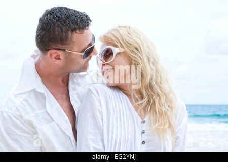 https://l450v.alamy.com/450v/eg2ynj/portrait-of-young-nice-couple-having-good-time-on-the-beach-eg2ynj.jpg