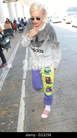 Rita Ora arrives at Los Angeles International Airport (LAX) wearing an Adidas sweater and a funky pair of casual sweatpants  Featuring: Rita Ora Where: Los Angeles, California, United States When: 12 Aug 2014