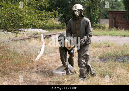 firefighters in chemical protection suit during the job Stock Photo