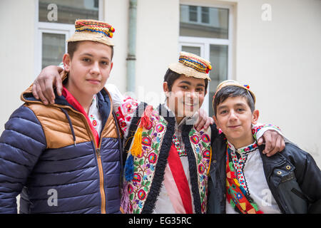 Romanian traditional costume in Sigisoara Transylvania with local people wearing felt and straw hats celebrating a Saints day