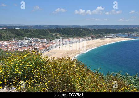 View on the beach of Nazaré Praia from the rocks of Nazaré Sitio. Stock Photo