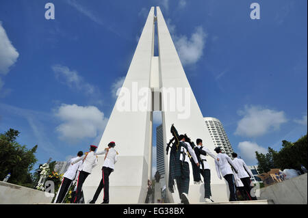 Singapore. 15th Feb, 2015. Singapore's National Cadet Corps' student cadets and Singapore Police Force bagpipers march into the War Memrial at Singapore's War Memorial Park on Feb. 15, 2015. The Singapore Chinese Chamber of Commerce and Industry ( SCCCI) on Sunday held the 48th war memorial service in commemoration of the civilian victims of the Japanese Occupation. Credit:  Then Chih Wey/Xinhua/Alamy Live News Stock Photo