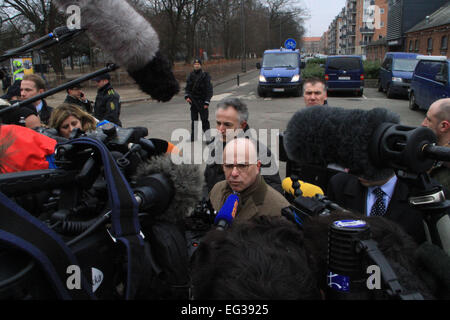 Denmark, Copenhagen. 15th Feb, 2015. French Interior Minister Bernard Cazeneuve (C) speaks during an interview in front of at the cultural center Krudttoenden, where a man was killed and three police officer were wounded, in Copenhagen, Feb. 15, 2015. Copenhagen's police director Thorkild Fogde said at a press conference that the police have identified the alleged offender, who was killed by police early Sunday morning in the Noerrebro neighborhood in Copenhagen. Credit:  Shi Shouhe/Xinhua/Alamy Live News Stock Photo