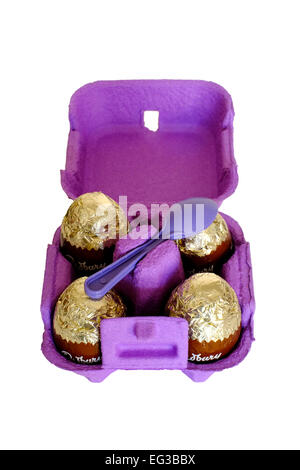 cadbury egg n spoon chocolate eggs in a purple box Stock Photo