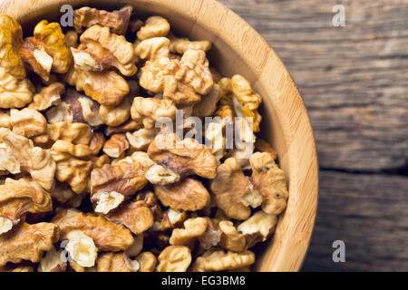 closeup of peeled walnuts in bowl Stock Photo