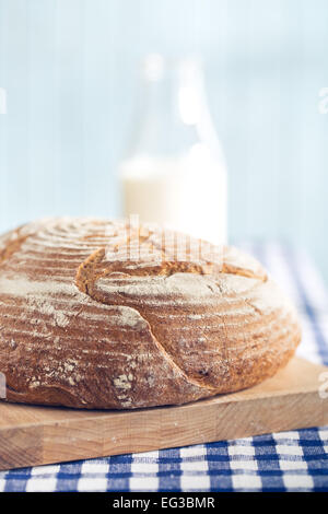 round bread on kitchen table Stock Photo