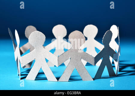 Team of paper people in chain