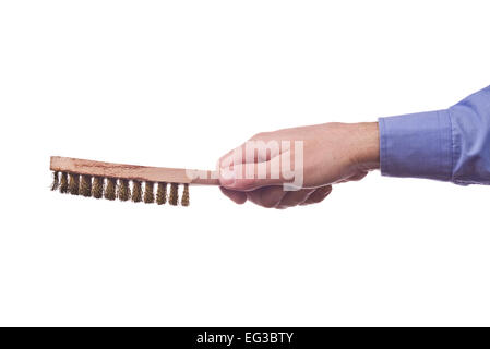 Male worker's hand holding steel wire bristes brush. Part of series set of images with DIY tools for home jobs and crafts Stock Photo
