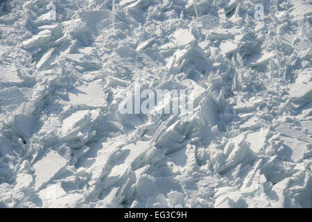 Detailed photo of frozen St-Lawrence River in Montreal, with crumbled ice and spikes. Stock Photo