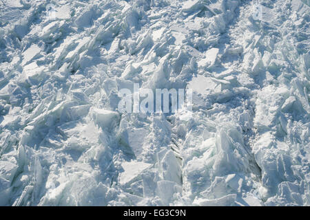 Detailed photo of frozen St-Lawrence River in Montreal, with crumbled ice and spikes. Stock Photo