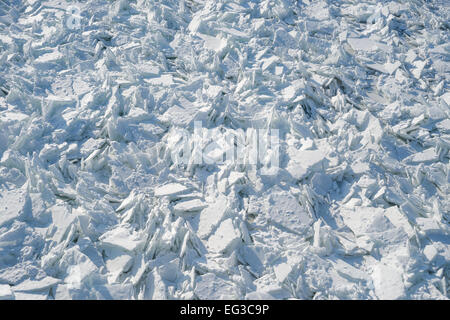 Detailed photo of frozen St-Lawrence River in Montreal, with crumbled ice and spikes. Stock Photo