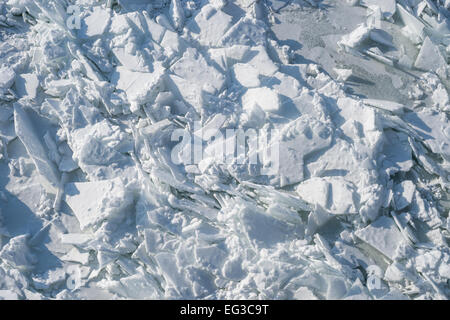 Detailed photo of frozen St-Lawrence River in Montreal, with crumbled ice and spikes. Stock Photo