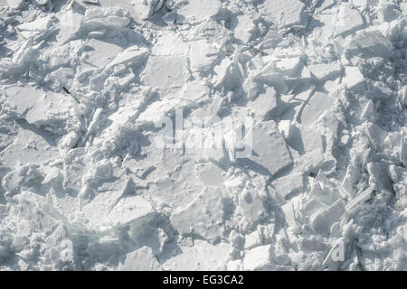 Detailed photo of frozen St-Lawrence River in Montreal, with crumbled ice and spikes. Stock Photo