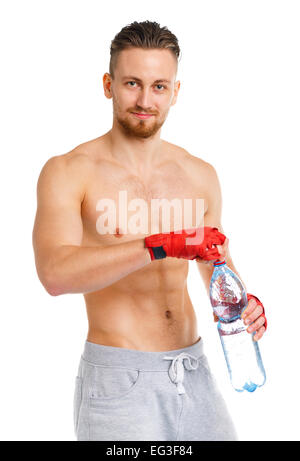 Sport attractive man wearing boxing bandages with bottle of water on the white background Stock Photo