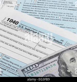 US Tax Form 1040 and 100 dollars Stock Photo