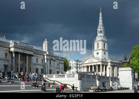 Trafalgar Square, London, England:  Storm clouds gather over London Stock Photo