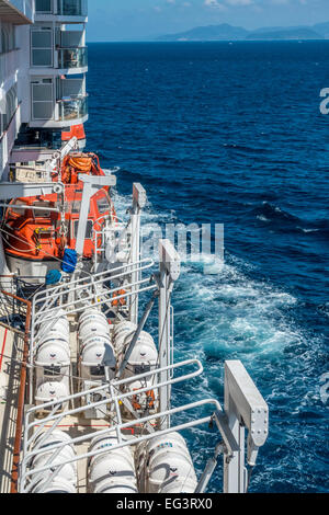 Life rafts in place on cruise liner at sea. Stock Photo