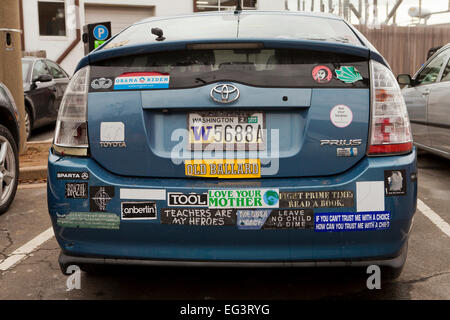 Toyota Prius hybrid car with many bumper stickers - USA Stock Photo