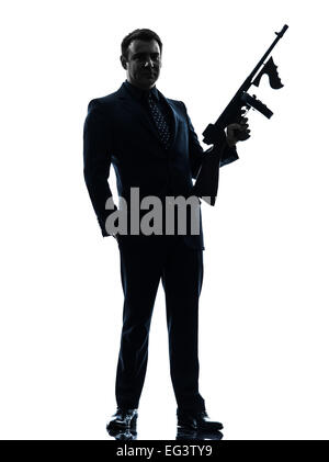 one  man holding thompson machine gun in silhouette on white background Stock Photo